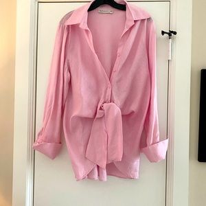 Pink linen blouse with French cuffs.